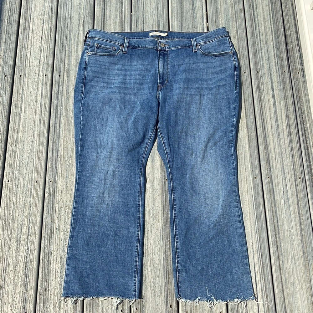 Levi’s - 415 classic boot - medium wash blue jeans - raw hem - size 22W